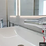 Home 23 다기능 헤어드라이기의 최신 기술 - A sleek, modern hairdryer with a digital brushless motor resting on a marble bathroom countertop in ...